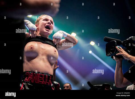 boxing girl flashes crowd after win|Boxer Daniella Hemsley celebrates win by flashing crowd